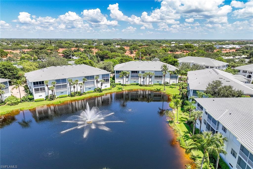 795 Bentwater Circle, Unit 203 Naples, FL 34108 - Photo 29 of 33 a view of a swimming pool with a patio