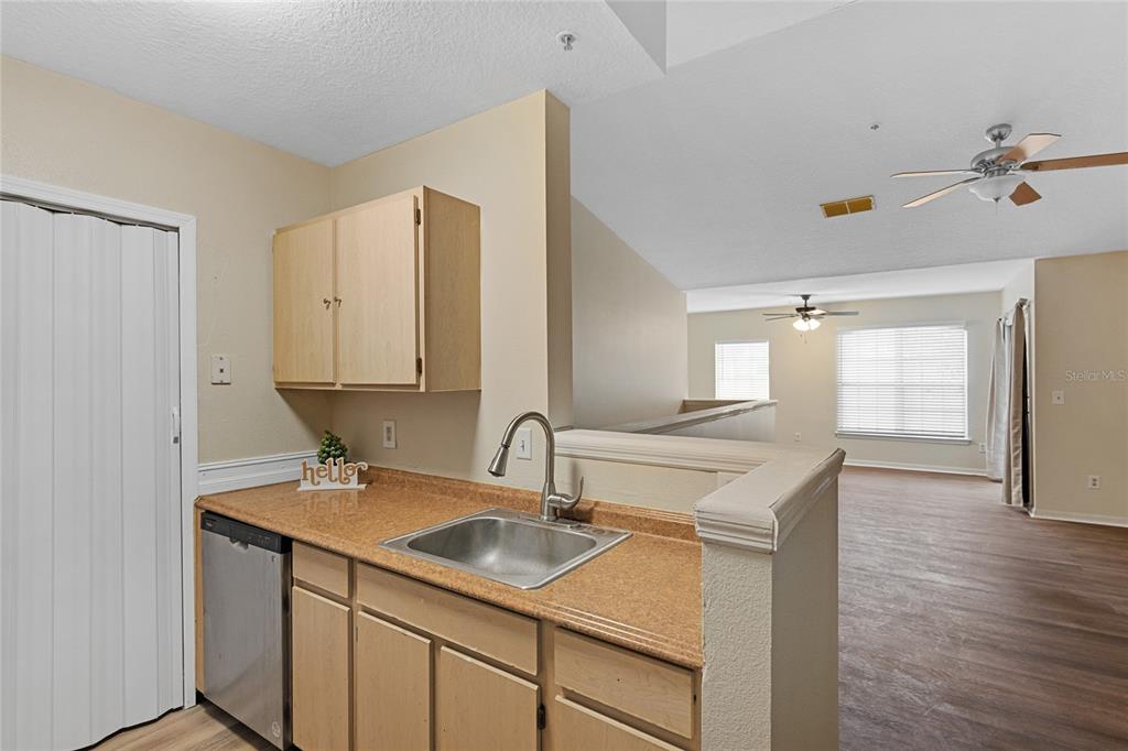 4360 South Kirkman Road, Unit 4 Orlando, FL 32811 - Photo 12 of 21 a kitchen with a sink cabinets and wooden floor