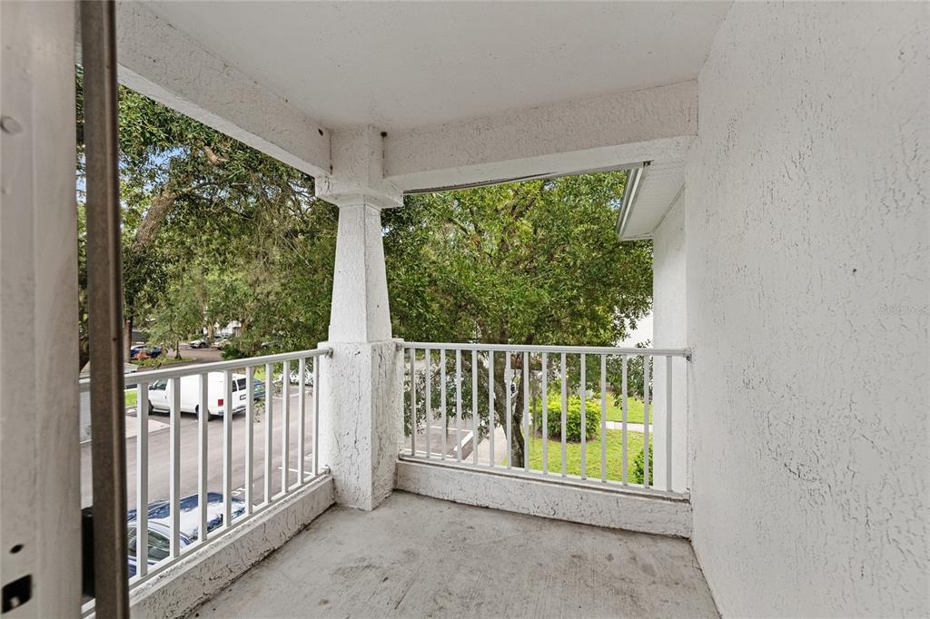 4360 South Kirkman Road, Unit 4 Orlando, FL 32811 - Photo 17 of 21 a view of a porch with a floor to ceiling window