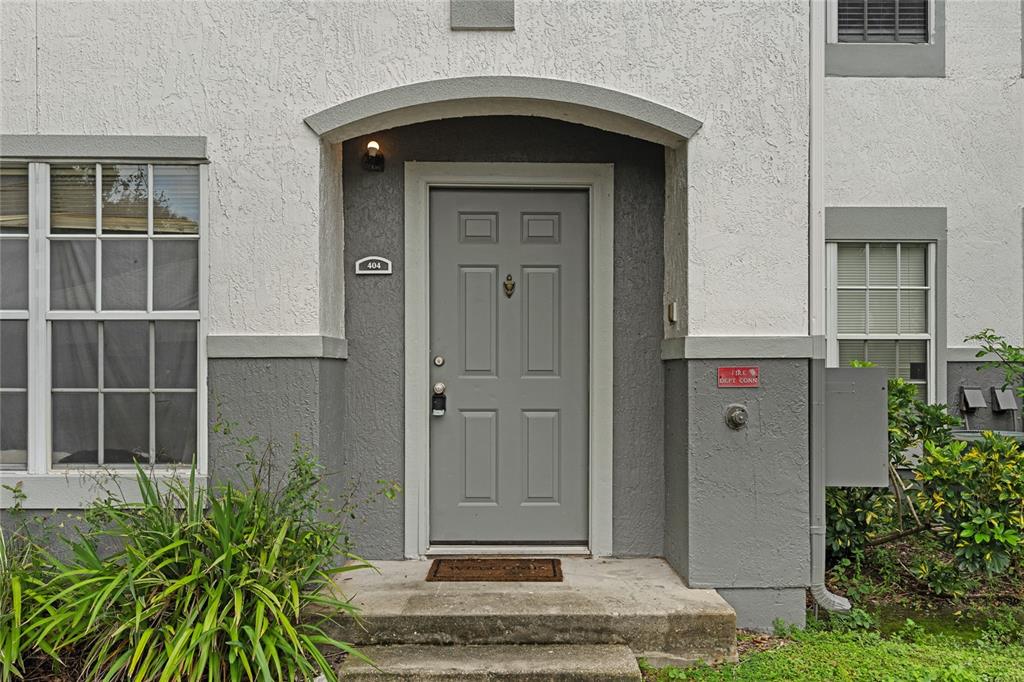4360 South Kirkman Road, Unit 4 Orlando, FL 32811 - Photo 4 of 21 a front view of a house with a shower