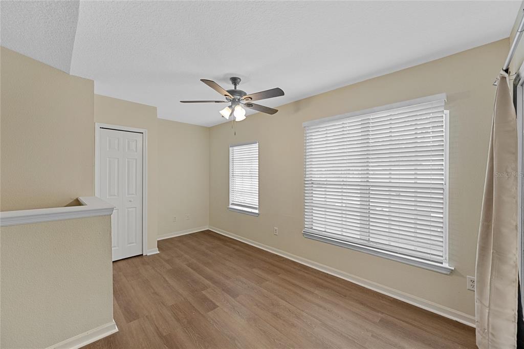 4360 South Kirkman Road, Unit 4 Orlando, FL 32811 - Photo 8 of 21 a view of an empty room with a window