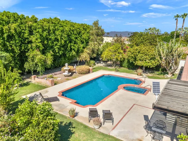 a view of a swimming pool with a garden