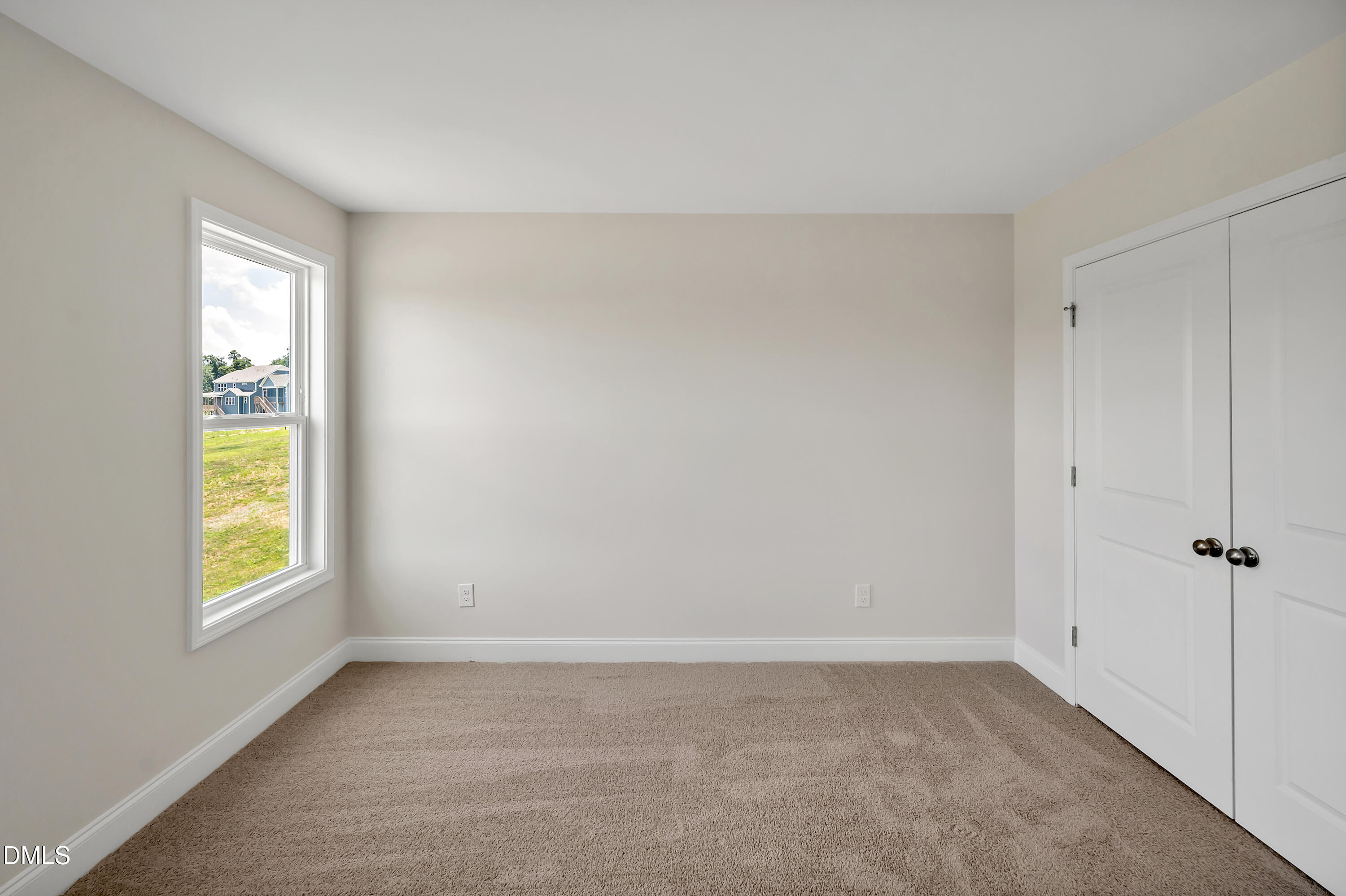 1108 Prominence Drive Durham, NC 27712 - Photo 16 of 27 an empty room with windows and closet