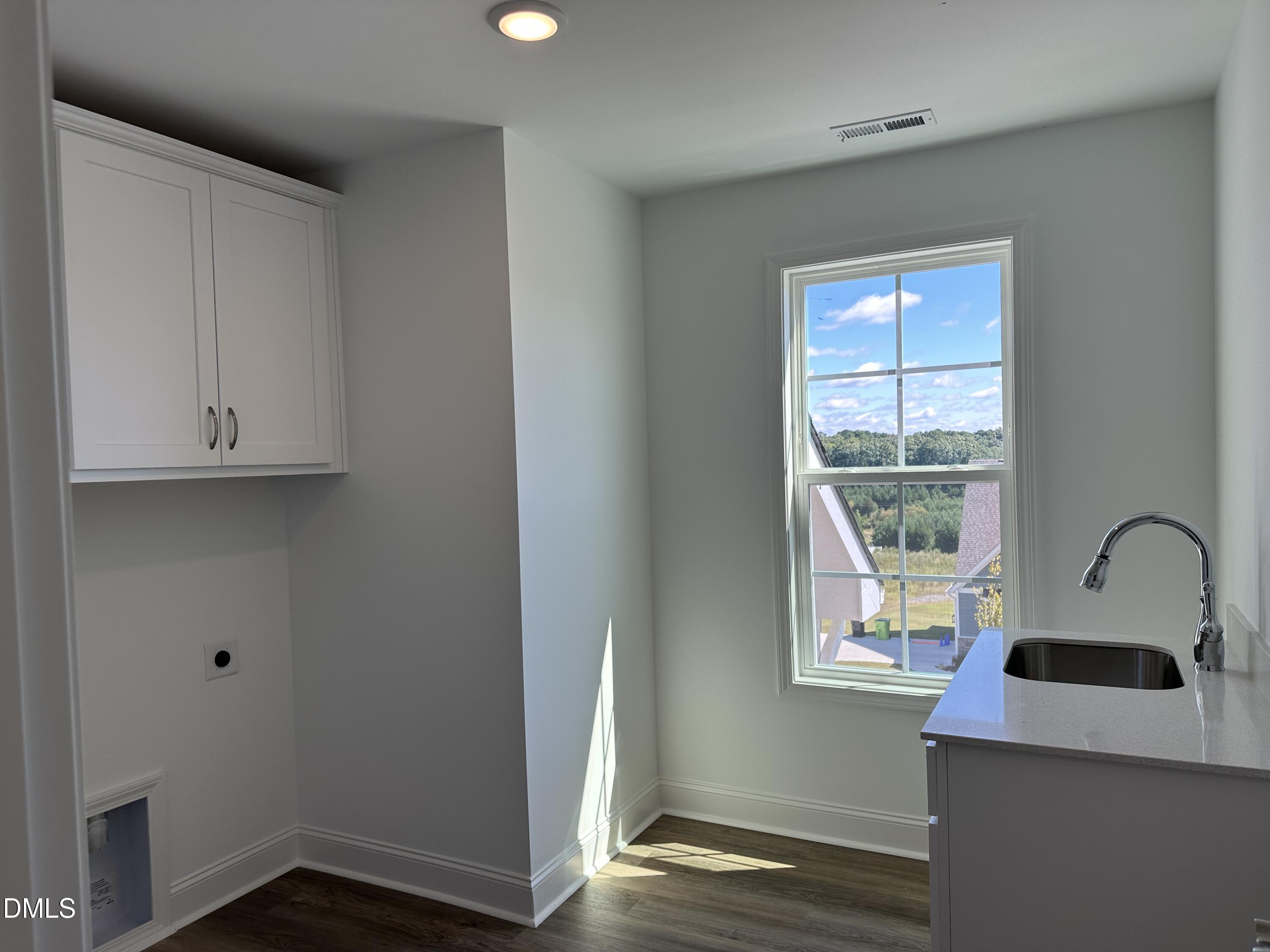 1108 Prominence Drive Durham, NC 27712 - Photo 18 of 27 a bathroom with a sink and a window