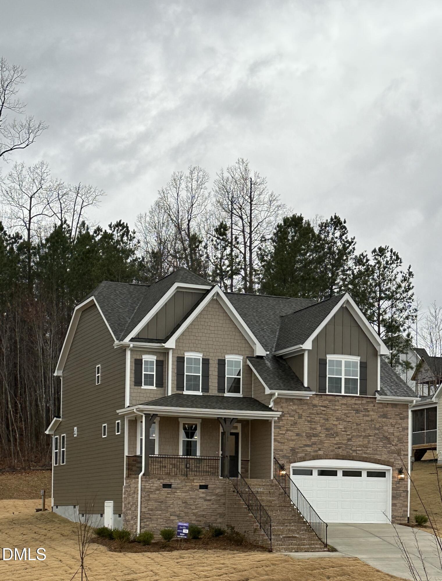 1108 Prominence Drive Durham, NC 27712 - Photo 23 of 27 a front view of a house with a yard