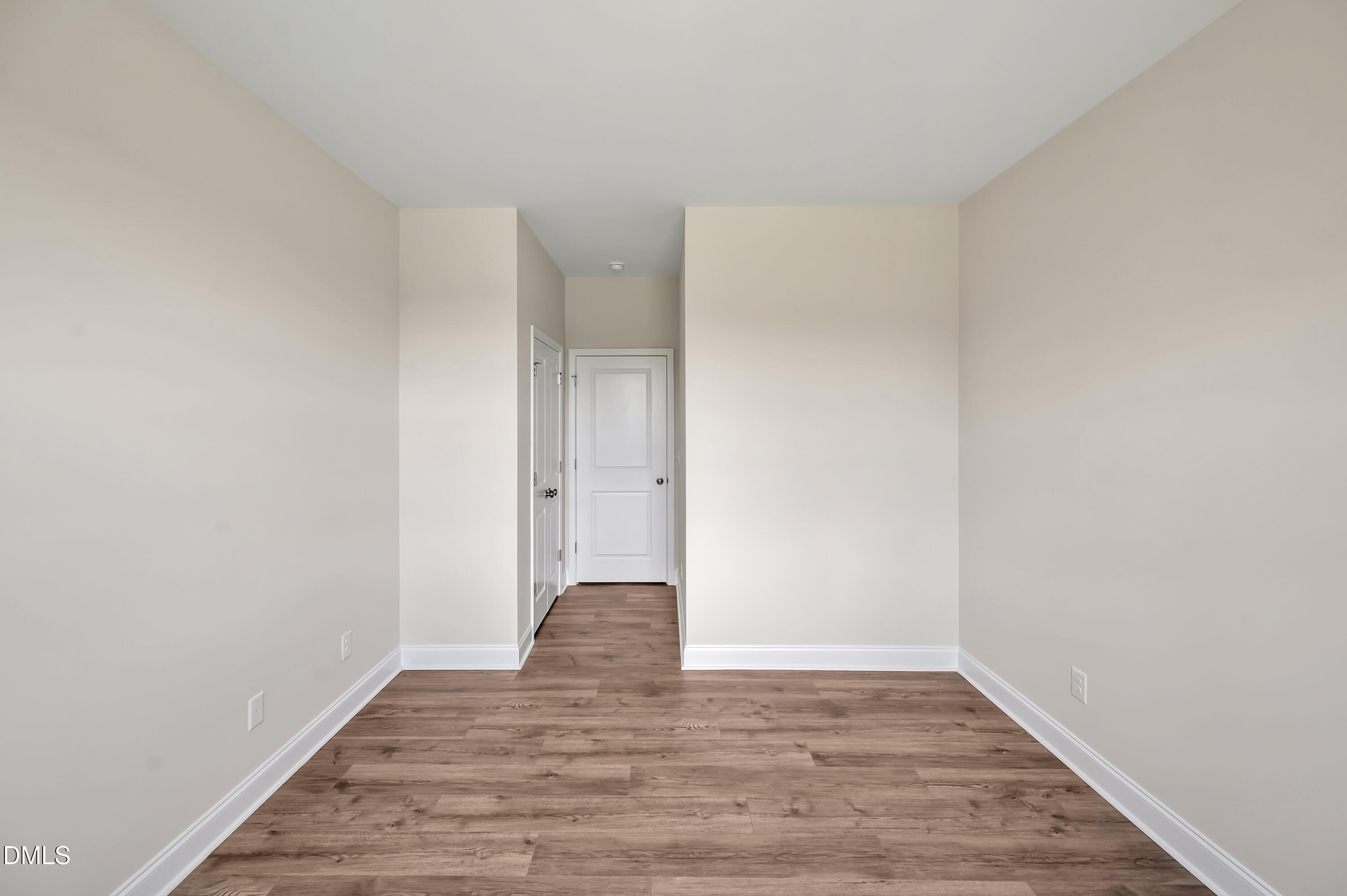 1108 Prominence Drive Durham, NC 27712 - Photo 10 of 27 a view of an empty room with wooden floor