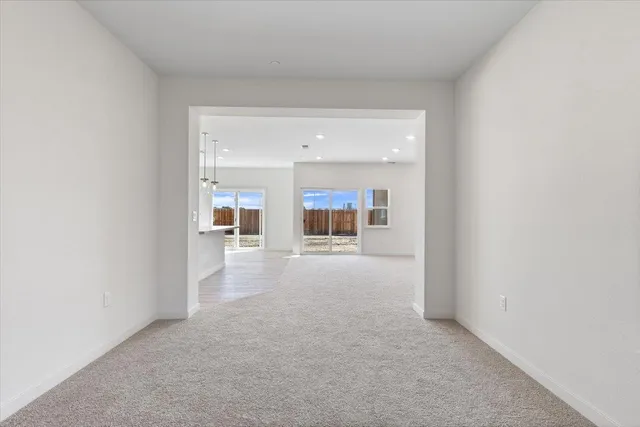 a kitchen with stainless steel appliances granite countertop a sink a stove top oven a counter space and cabinets