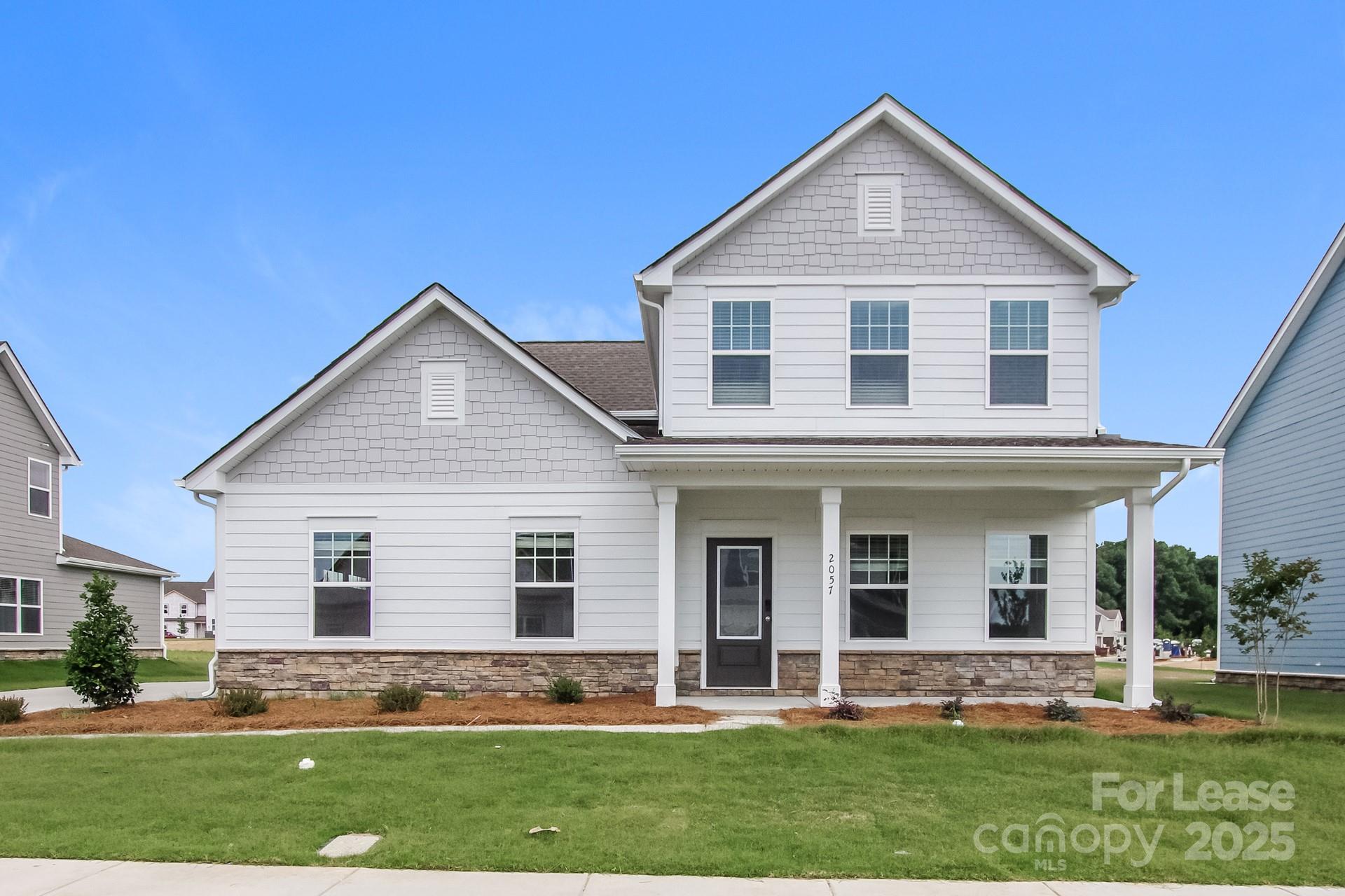 2057 Swanport Lane Monroe, NC 28110 - Photo 1 of 17 a front view of a house with a yard