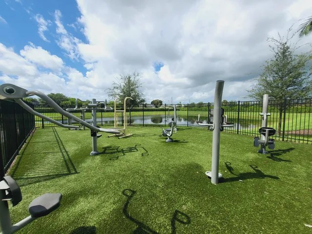a view of a swimming pool and lounge chairs
