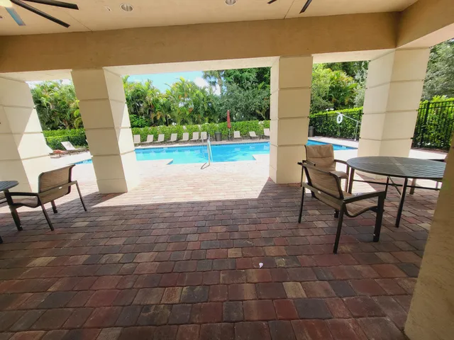 a front view of house with yard and outdoor seating