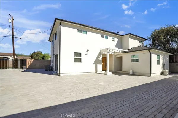a big house with wooden floor and a yard