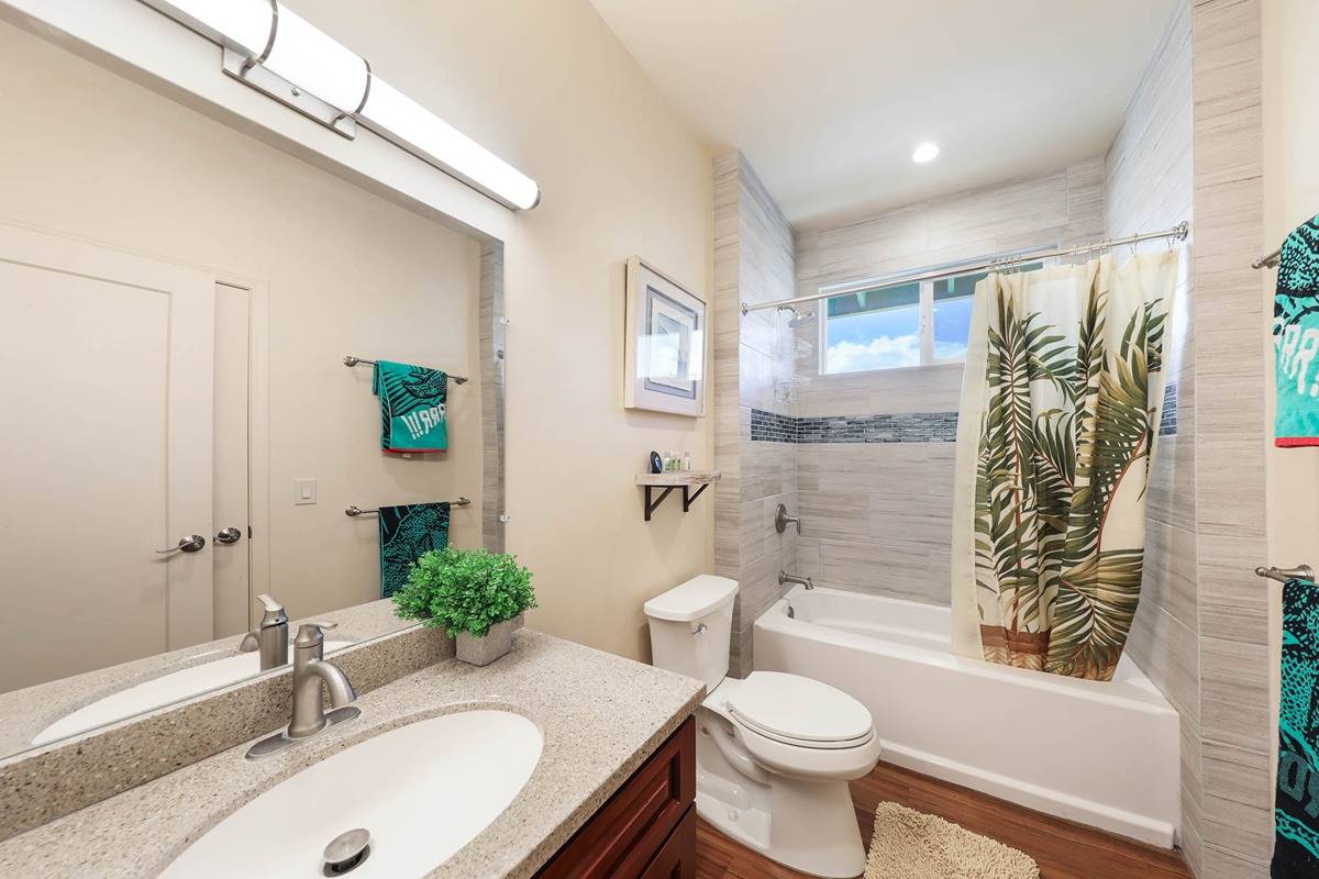 4598 Pueo Road, Unit B Kekaha, HI 96752 - Photo 13 of 27 a bathroom with a sink a toilet and shower