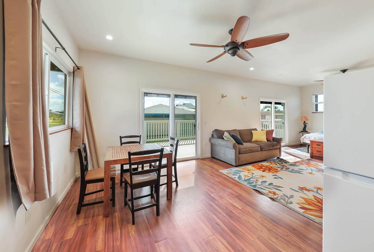 4598 Pueo Road, Unit B Kekaha, HI 96752 - Photo 15 of 27 a living room with furniture and a wooden floor