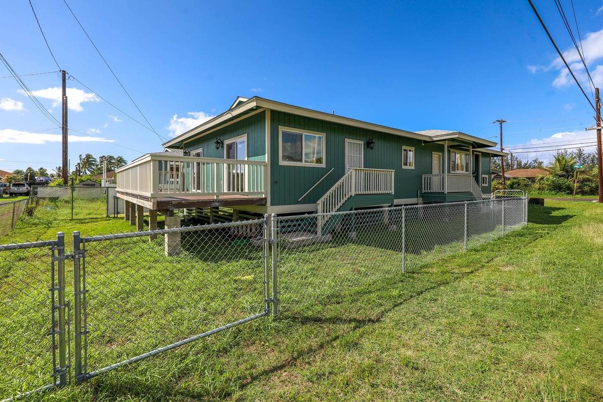 4598 Pueo Road, Unit B Kekaha, HI 96752 - Photo 22 of 27 a backyard of a house with table and chairs
