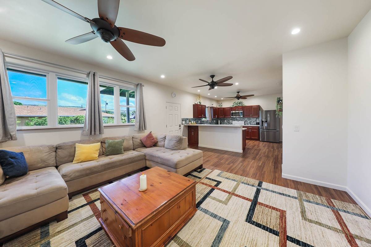 4598 Pueo Road, Unit B Kekaha, HI 96752 - Photo 5 of 27 a living room with furniture and a large window