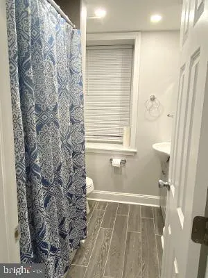 a bathroom with a bathtub and shower