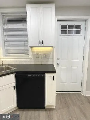 a kitchen with a sink and cabinets