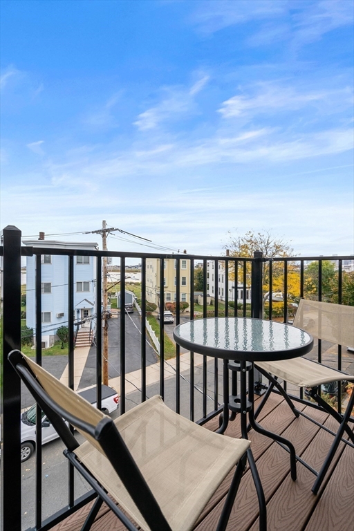 130 Coleridge Street, Unit 6 Boston, MA 02128 - Photo 12 of 26 a view of a balcony with chairs