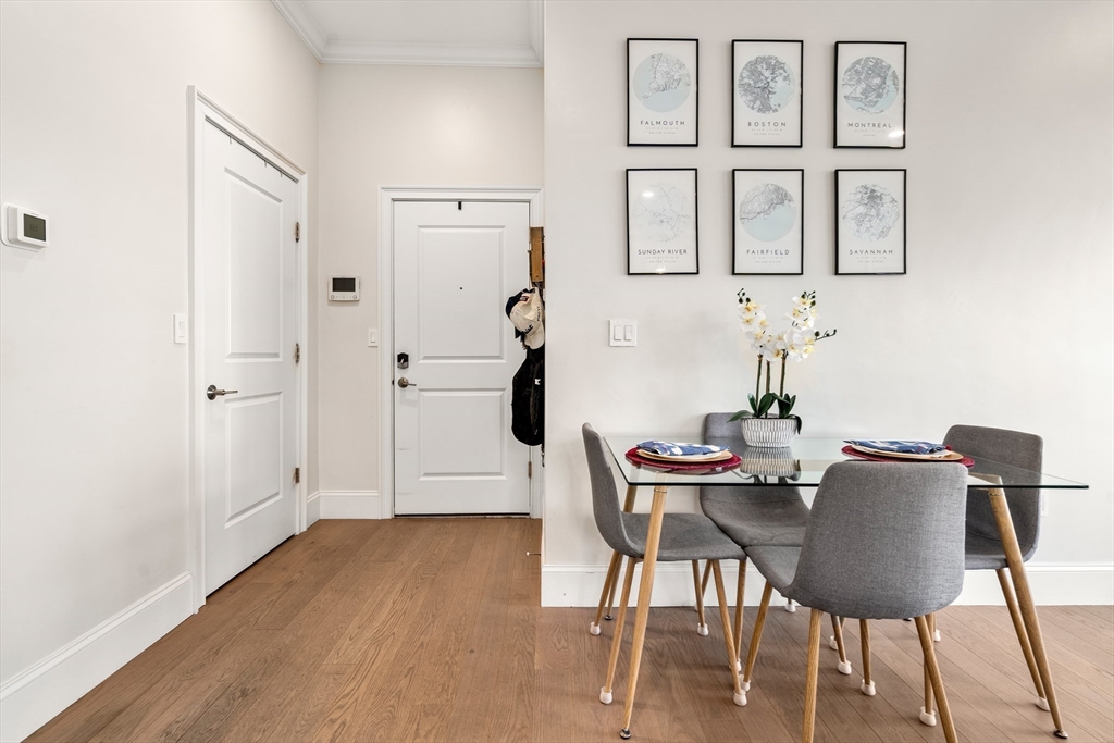 130 Coleridge Street, Unit 6 Boston, MA 02128 - Photo 3 of 26 a view of a dining room with furniture and wooden floor