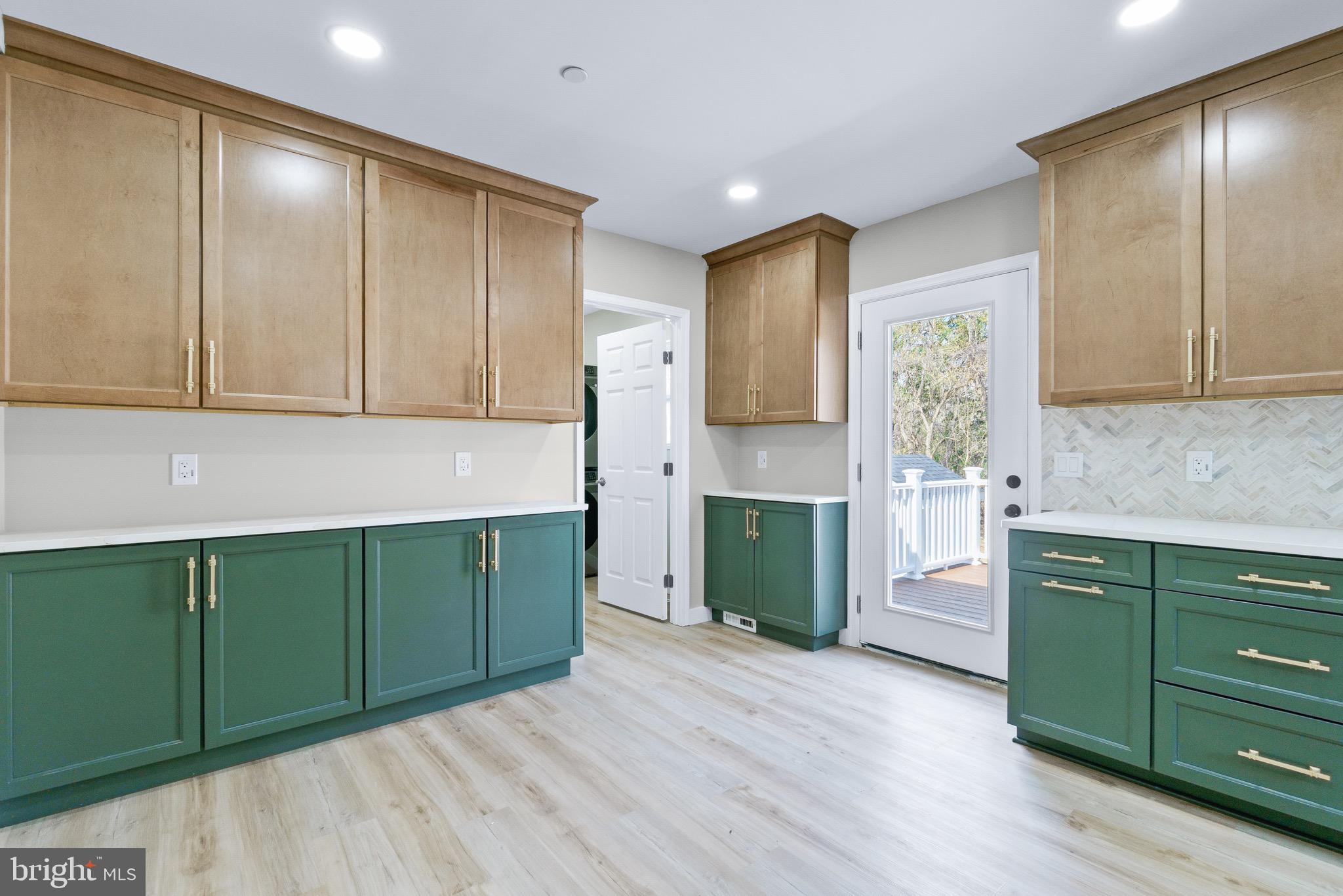 11 Baker Street Mount Airy, MD 21771 - Photo 16 of 30 a kitchen with stainless steel appliances granite countertop a refrigerator and a cabinets