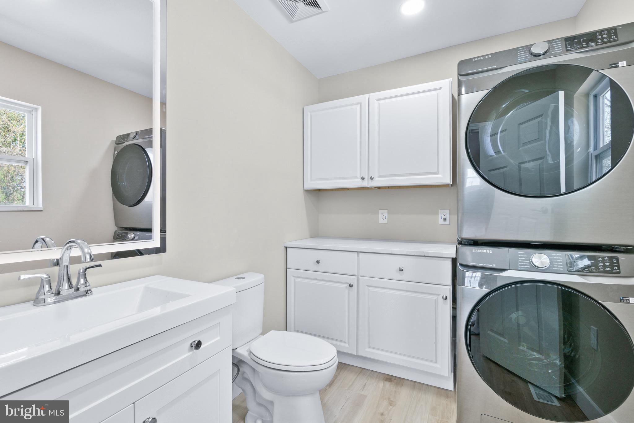 11 Baker Street Mount Airy, MD 21771 - Photo 18 of 30 a bathroom with a toilet and a sink