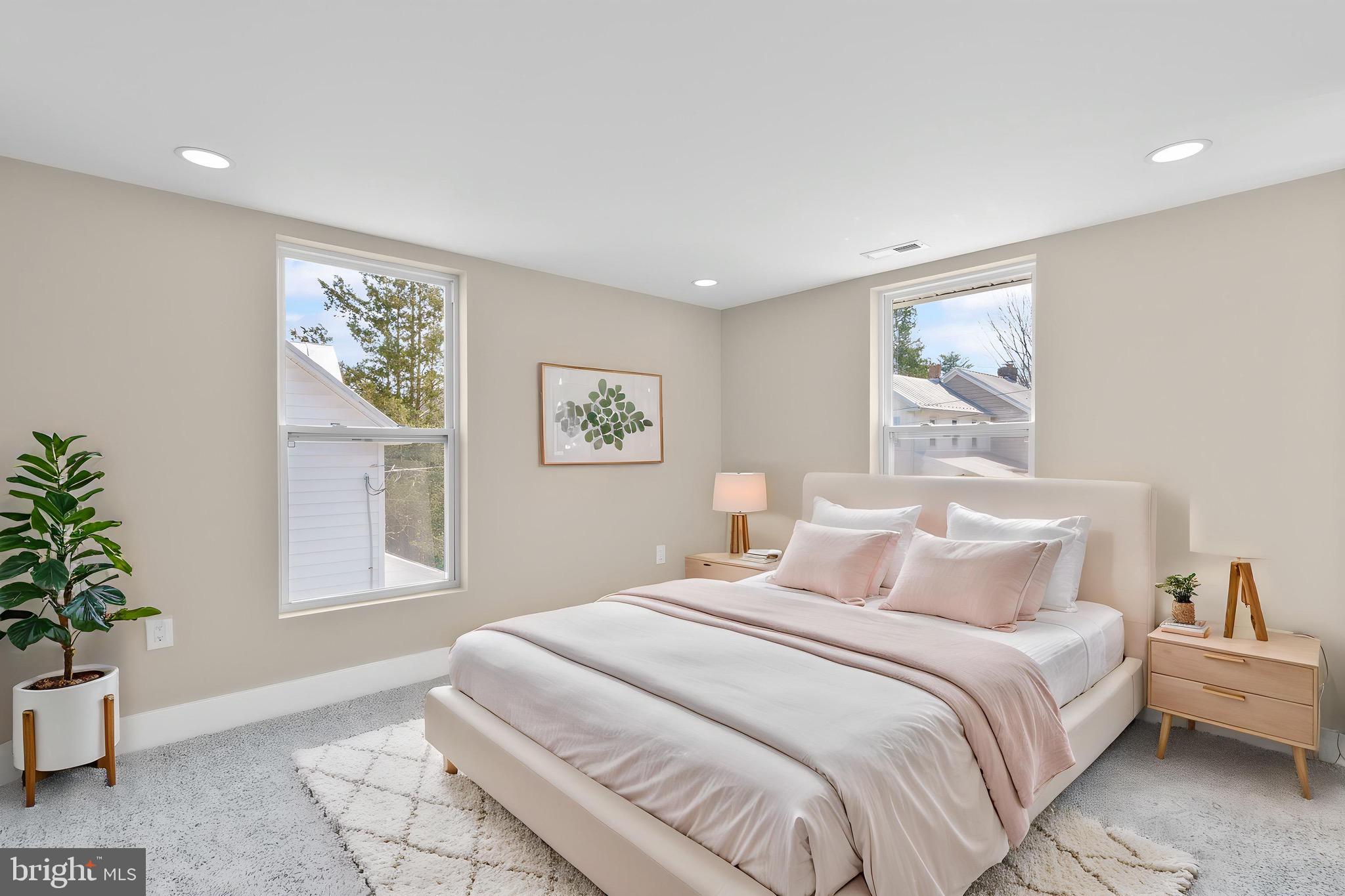 11 Baker Street Mount Airy, MD 21771 - Photo 19 of 30 a bedroom with a large bed and a potted plant