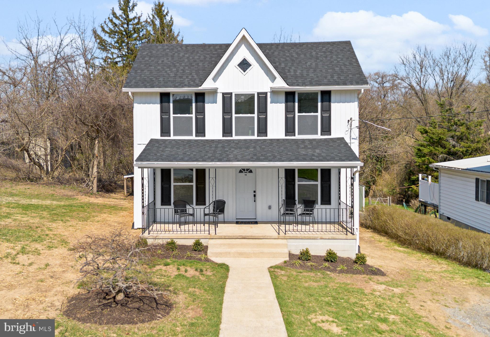 11 Baker Street Mount Airy, MD 21771 - Photo 2 of 30 a front view of house with yard patio and fire pit