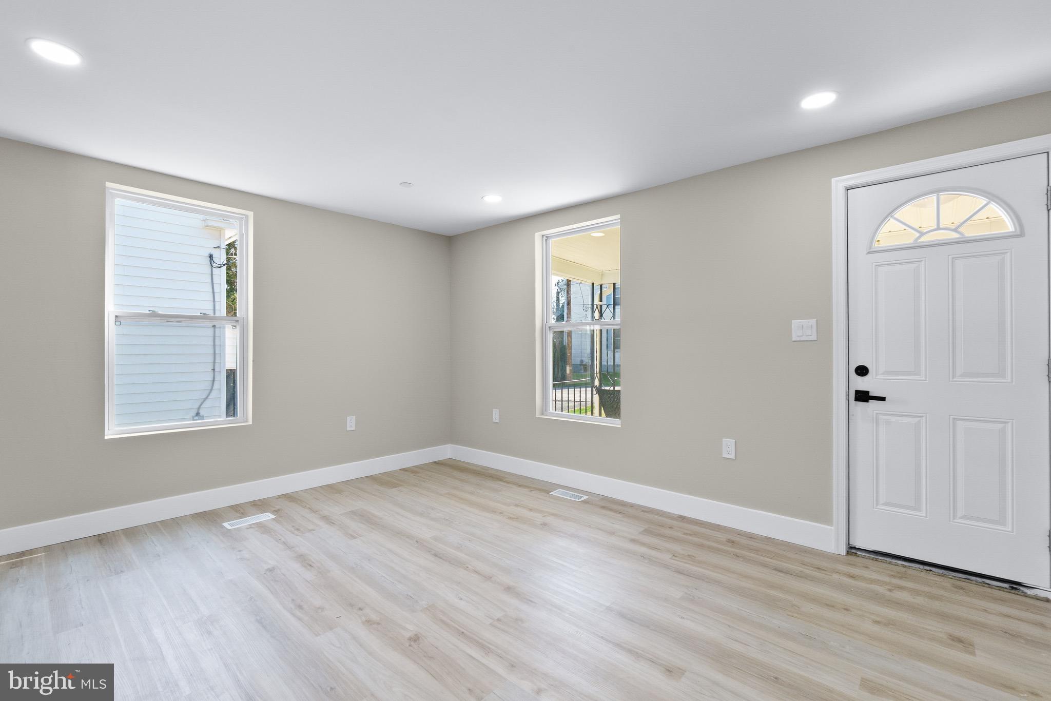 11 Baker Street Mount Airy, MD 21771 - Photo 28 of 30 a view of an empty room with wooden floor and a window