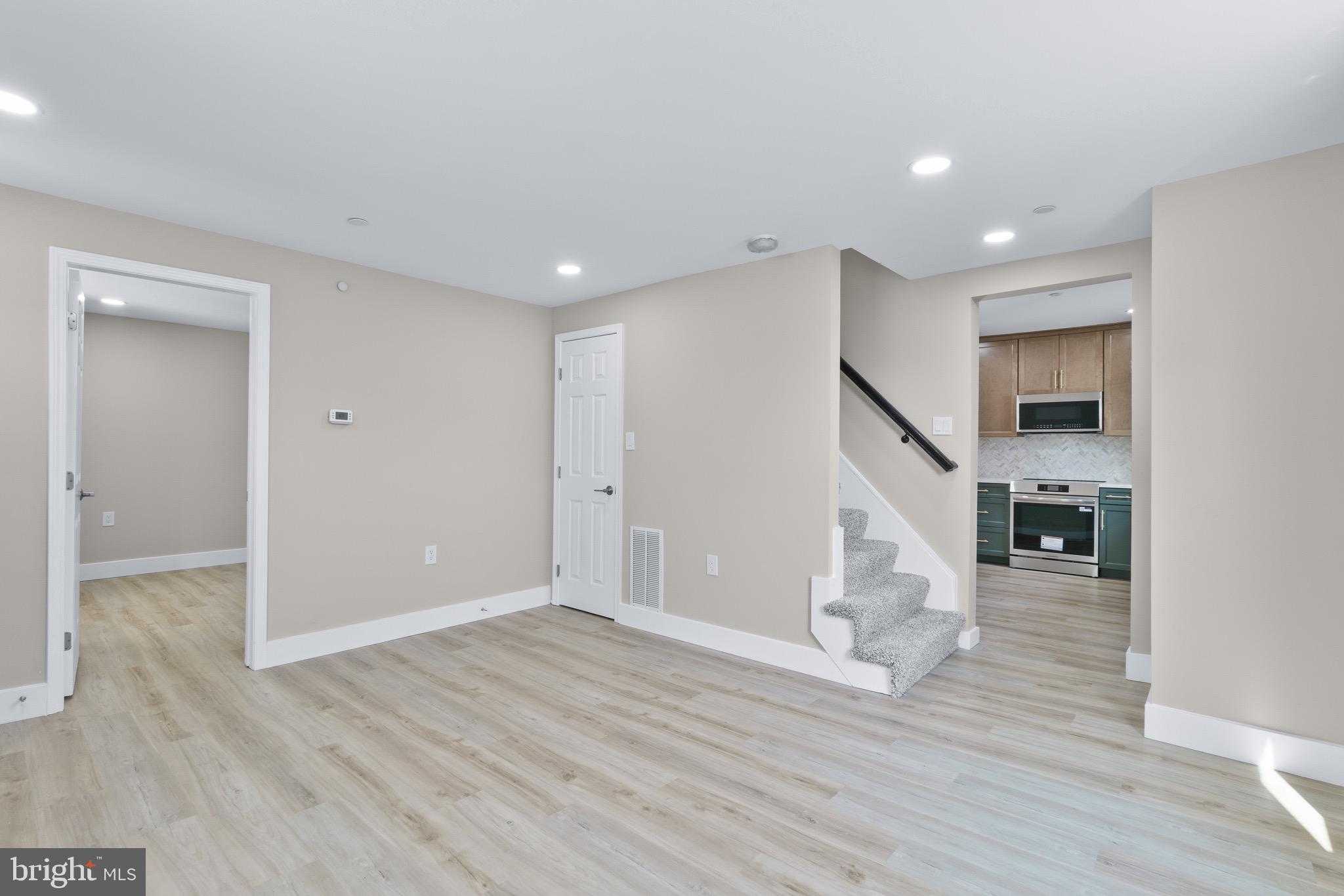11 Baker Street Mount Airy, MD 21771 - Photo 30 of 30 a view of empty room with wooden floor and fireplace