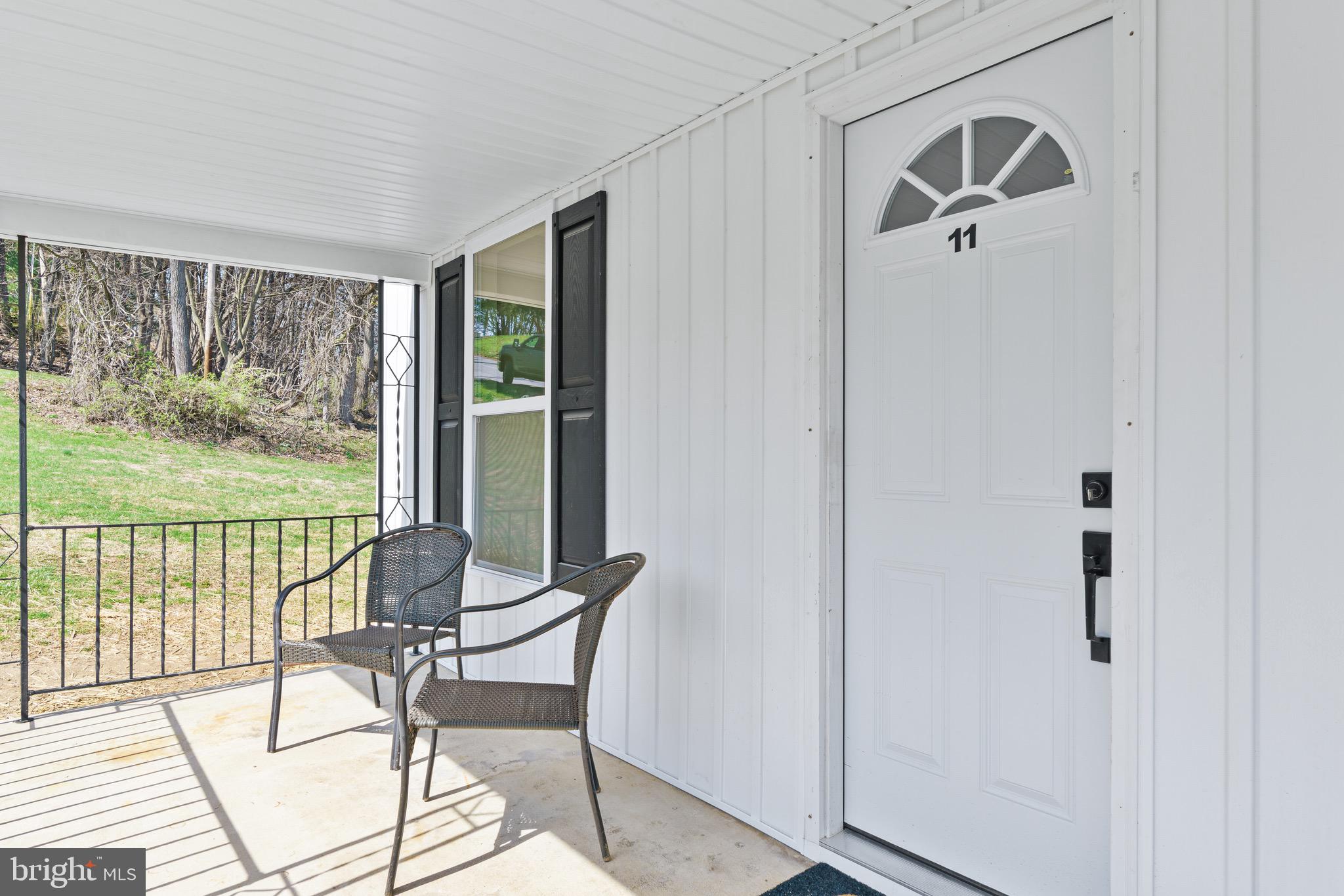 11 Baker Street Mount Airy, MD 21771 - Photo 7 of 30 a view of a livingroom with furniture window and outside view