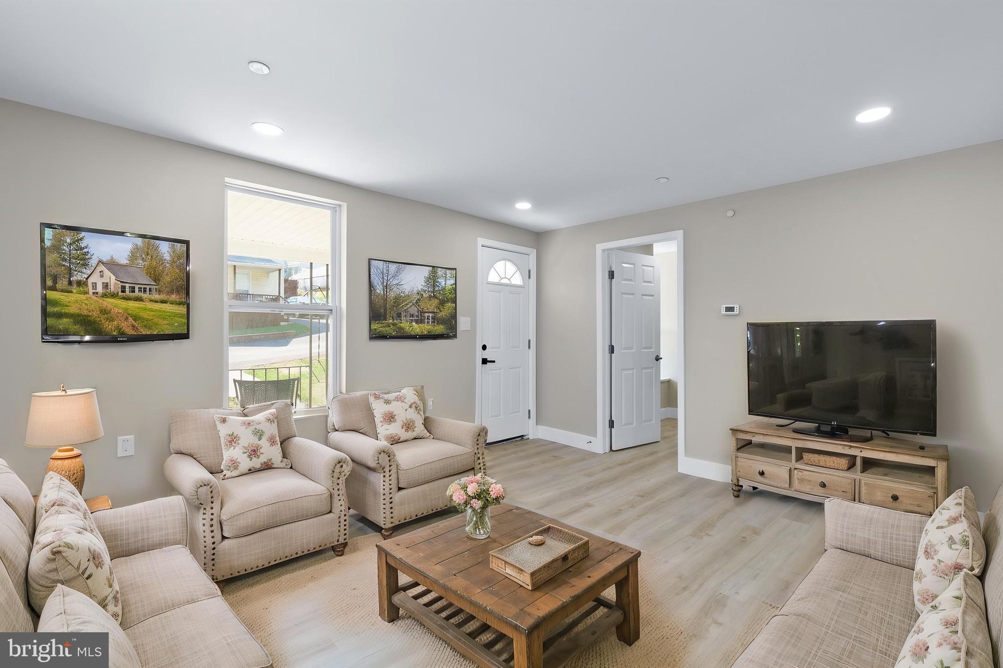 11 Baker Street Mount Airy, MD 21771 - Photo 10 of 30 a living room with furniture and a flat screen tv