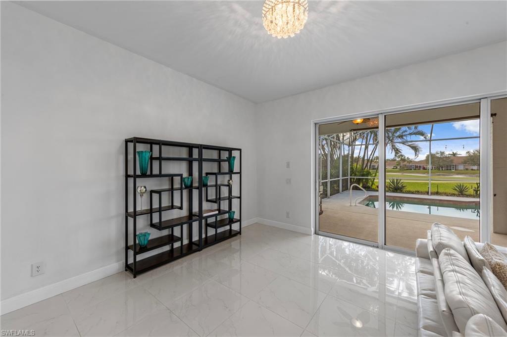 21550 Berwhich Run Estero, FL 33928 - Photo 11 of 50 an empty room with windows