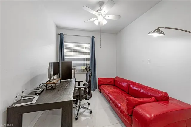 a view of a workspace with furniture