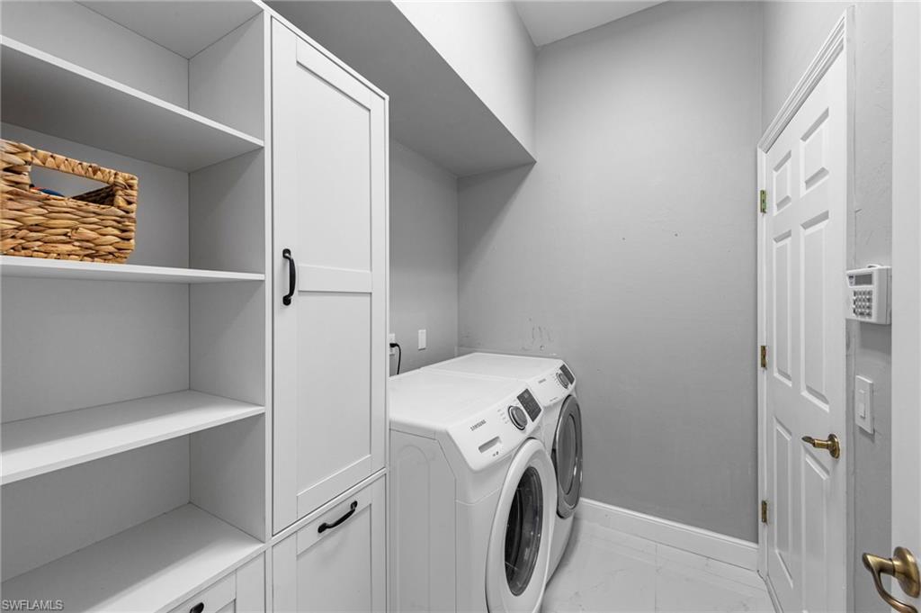 21550 Berwhich Run Estero, FL 33928 - Photo 29 of 50 a utility room with dryer and washer