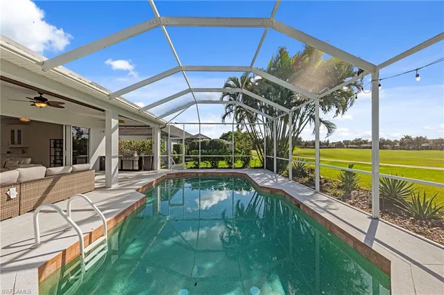a view of a swimming pool with a patio
