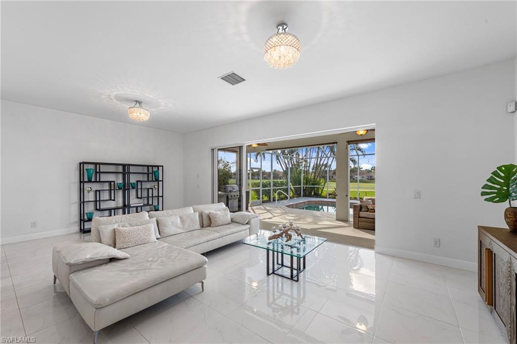 21550 Berwhich Run Estero, FL 33928 - Photo 4 of 50 a living room with furniture and a large window
