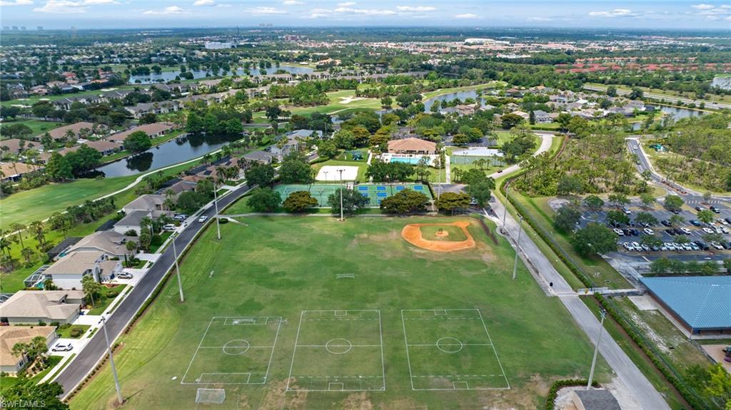 21550 Berwhich Run Estero, FL 33928 - Photo 48 of 50 an aerial view of residential houses with outdoor space and lake view