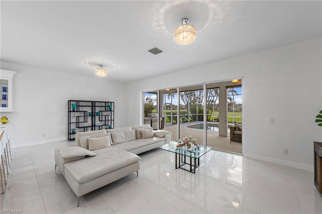 21550 Berwhich Run Estero, FL 33928 - Photo 6 of 50 a living room with furniture and a large window