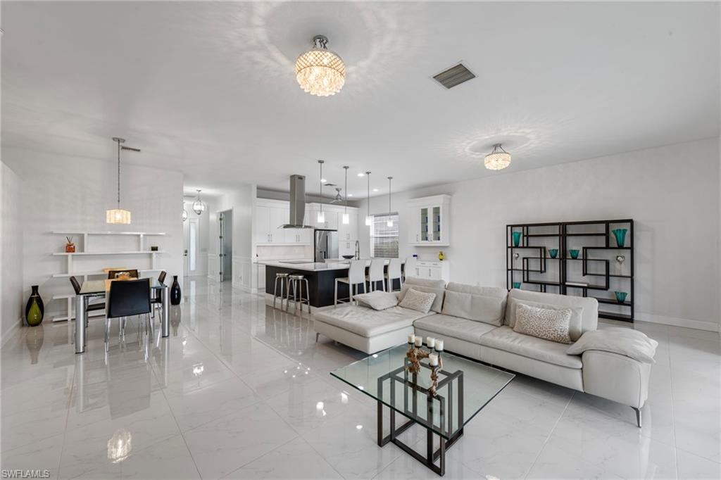 21550 Berwhich Run Estero, FL 33928 - Photo 7 of 50 a living room with furniture