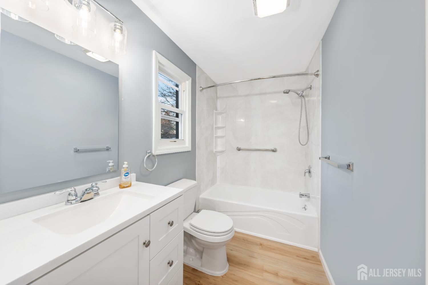 25 Dane Street Sayreville, NJ 08872 - Photo 17 of 31 a bathroom with a sink a toilet and shower