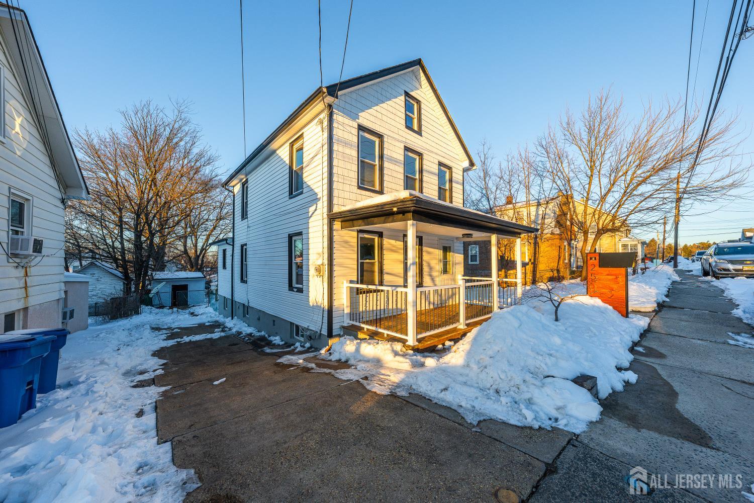 25 Dane Street Sayreville, NJ 08872 - Photo 2 of 31 a view of a house with a snow on the road