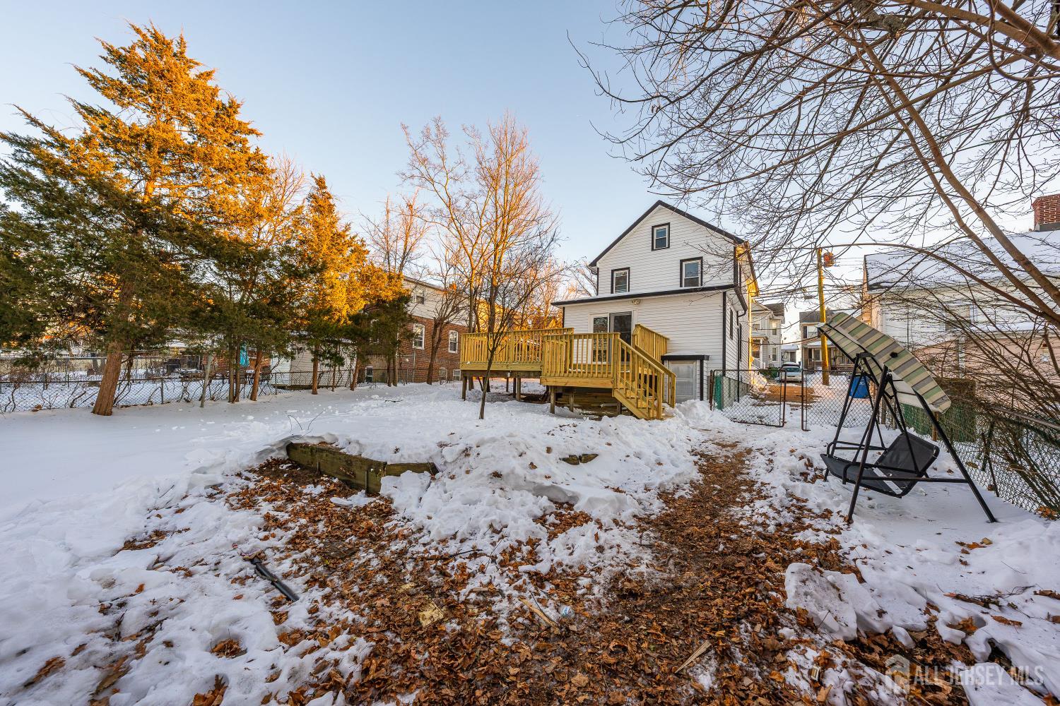 25 Dane Street Sayreville, NJ 08872 - Photo 23 of 31 a white house that has a tree in front of it