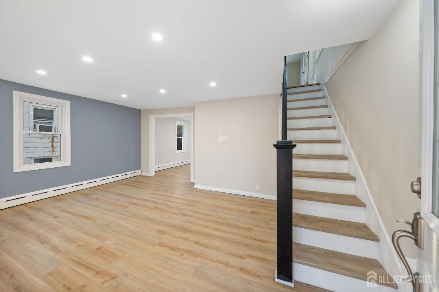 25 Dane Street Sayreville, NJ 08872 - Photo 4 of 31 a view of entryway with wooden floor