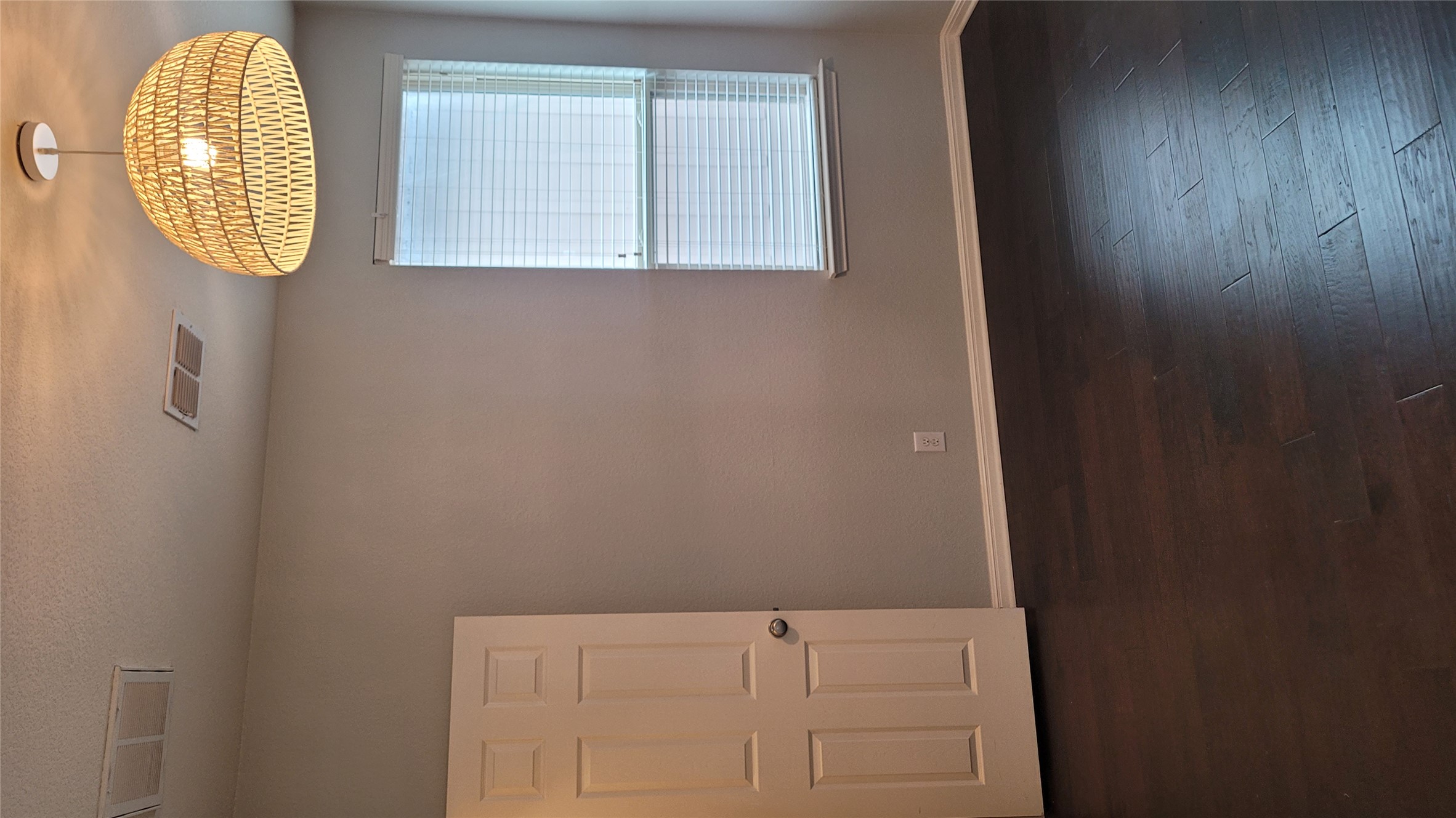 7337 Menchaca Road, Unit #22 Austin, TX 78745 - Photo 18 of 25 Empty room featuring baseboards, wood-flooring