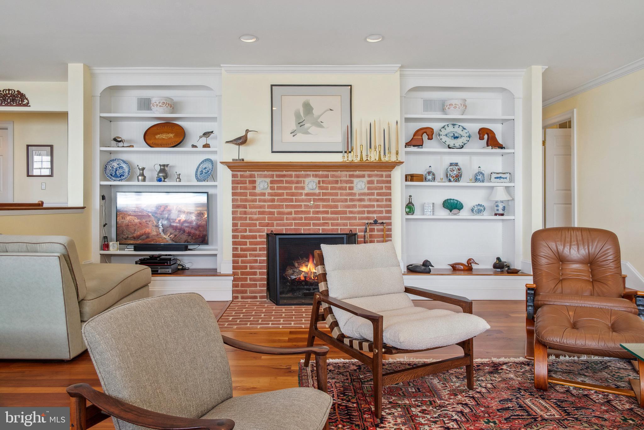 4742 Huntingfield Road Rock Hall, MD 21661 - Photo 11 of 42 Fireplace in sunken family room with built ins