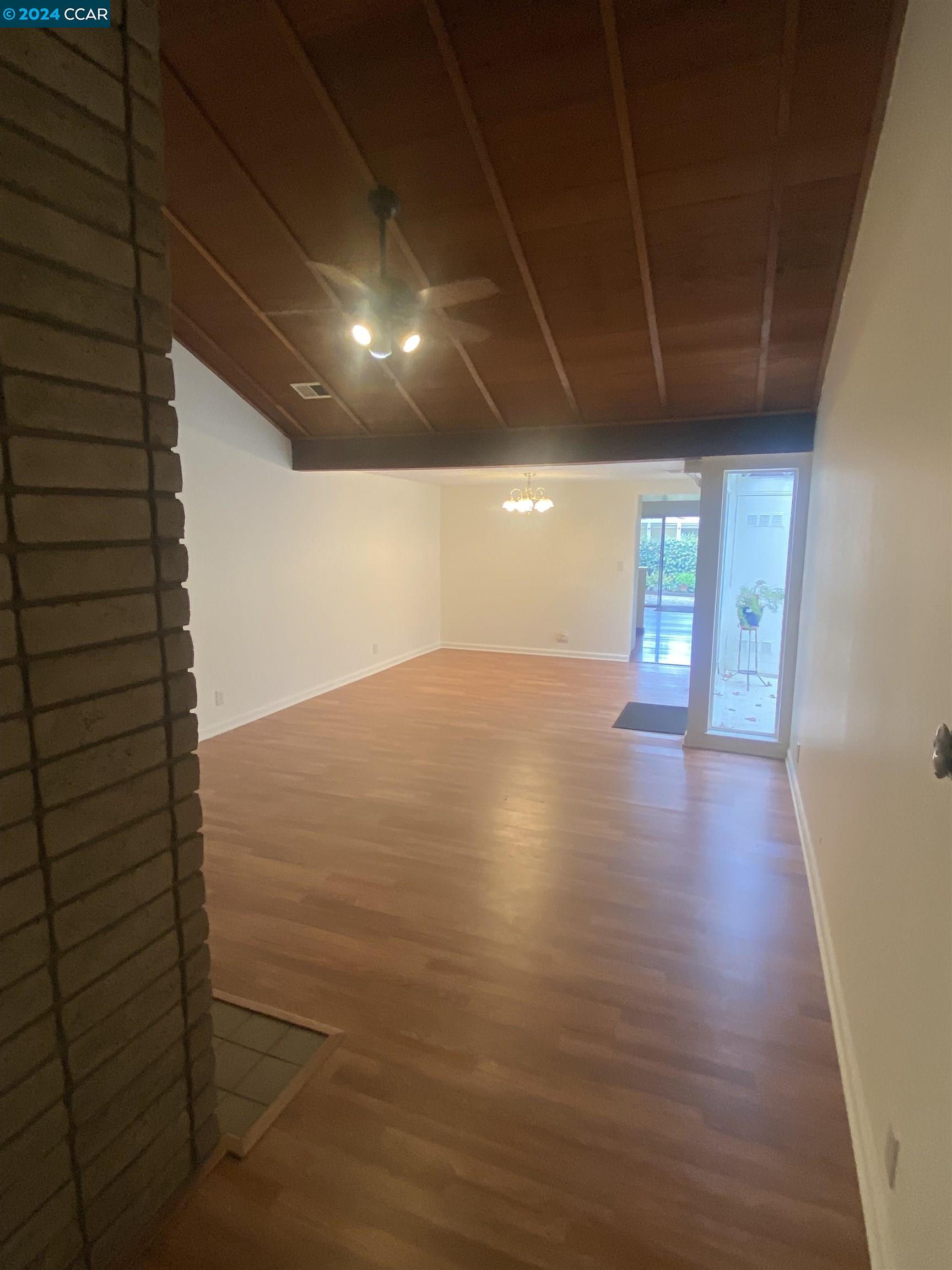 506 Tampico Walnut Creek, CA 94598 - Photo 17 of 32 a view of an empty room with wooden floor