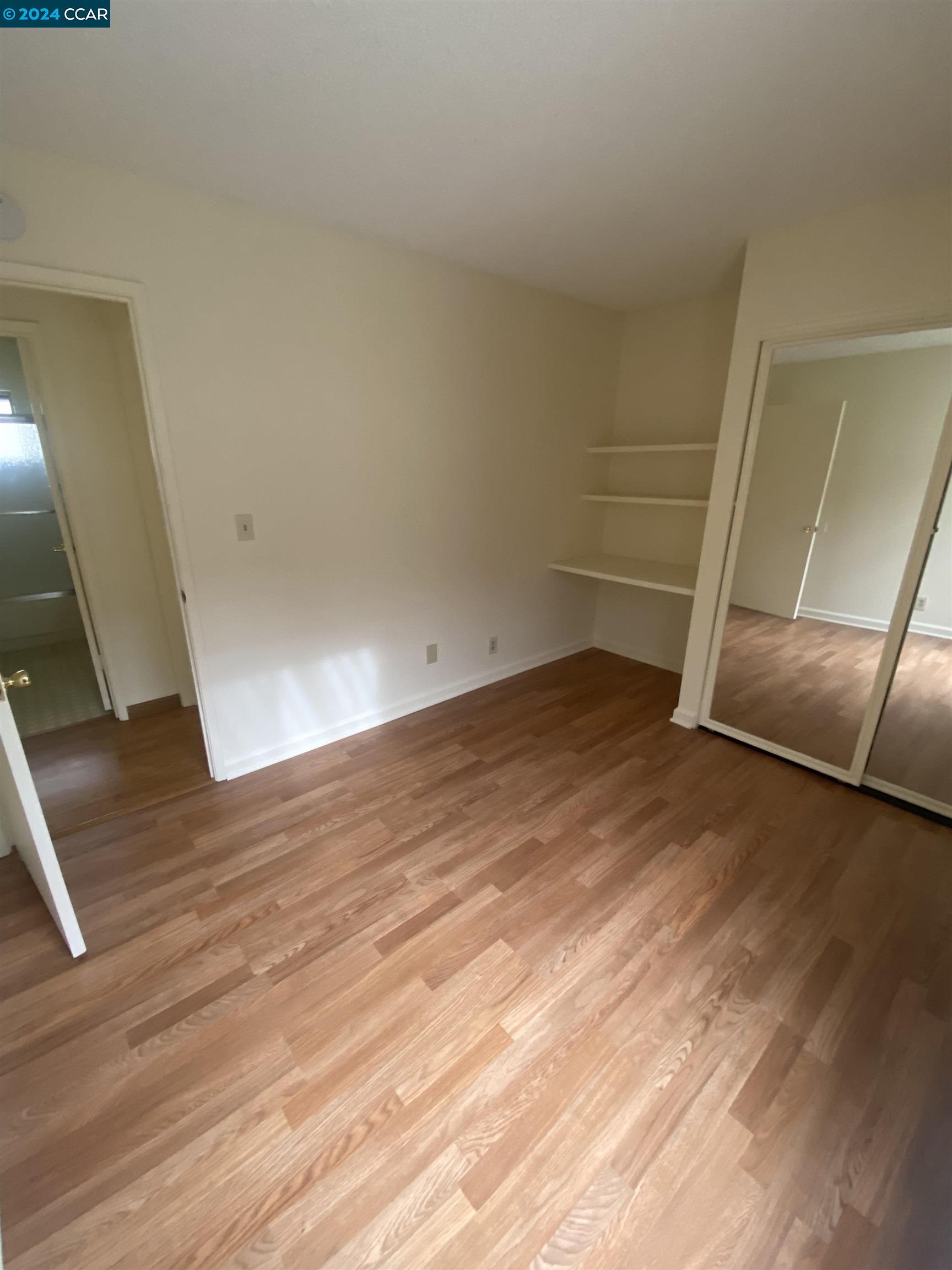 506 Tampico Walnut Creek, CA 94598 - Photo 20 of 32 an empty room with wooden floor