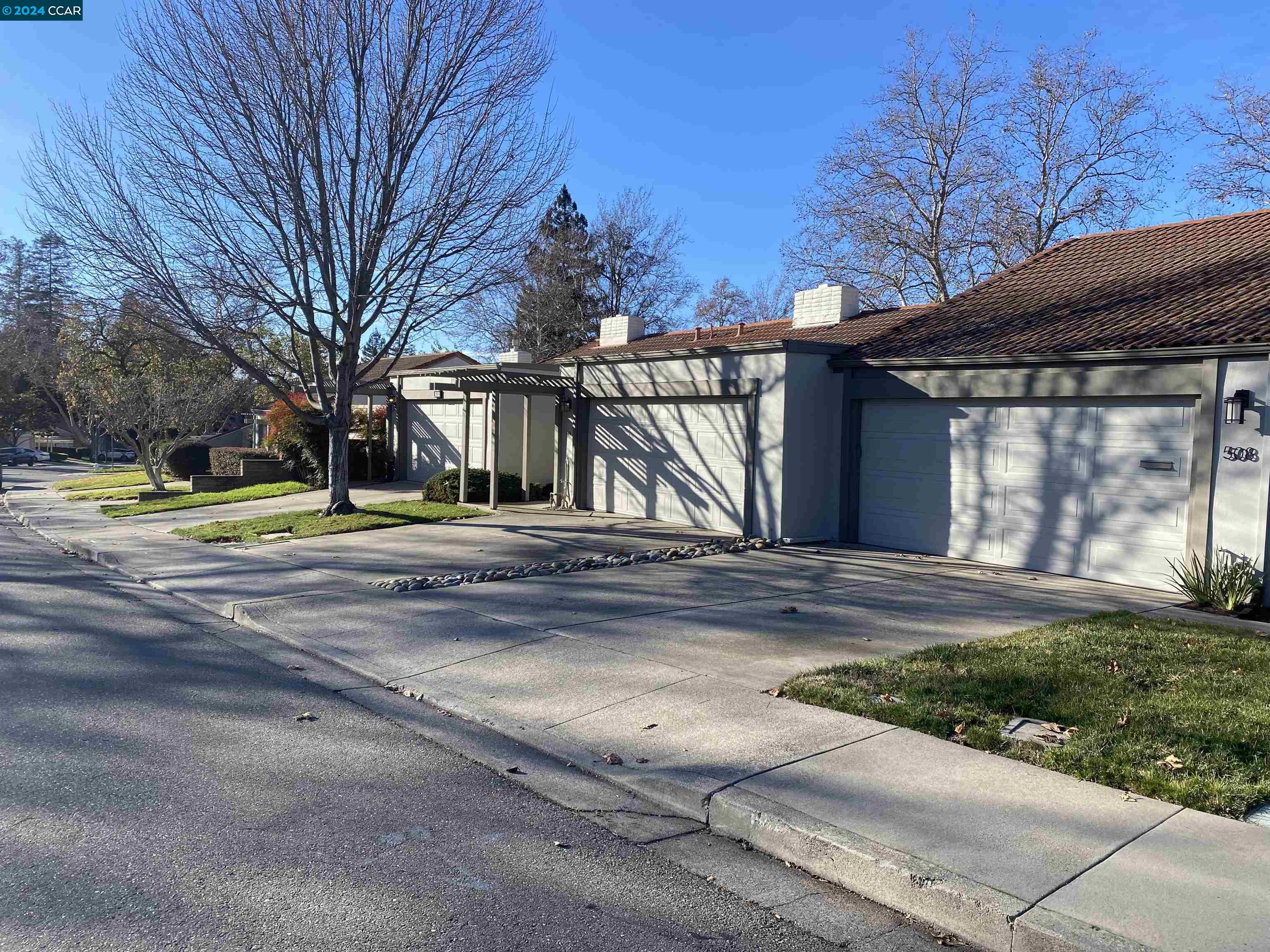 506 Tampico Walnut Creek, CA 94598 - Photo 2 of 32 a view of street along with house and trees