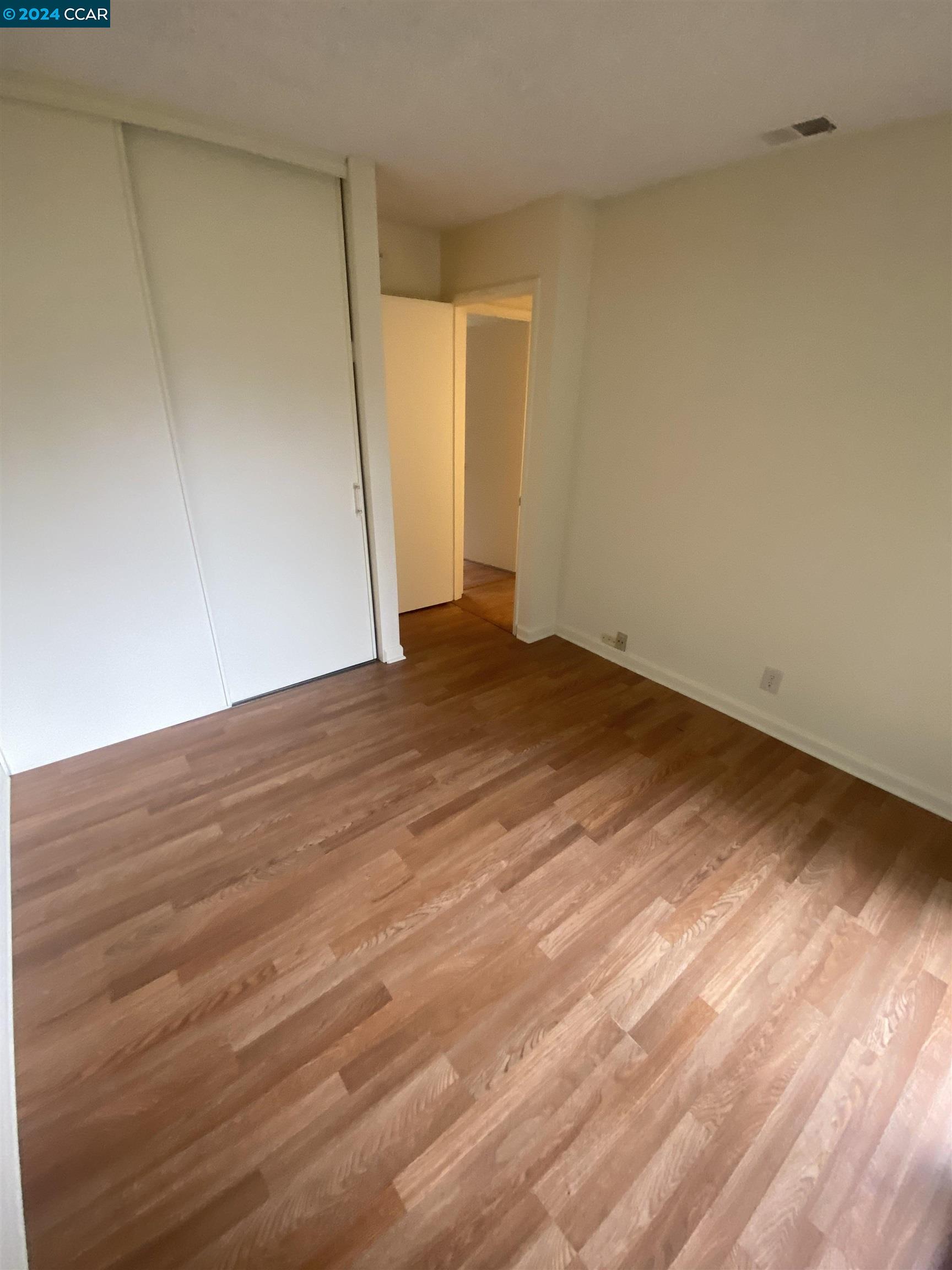 506 Tampico Walnut Creek, CA 94598 - Photo 24 of 32 a view of an empty room with wooden floor and a window