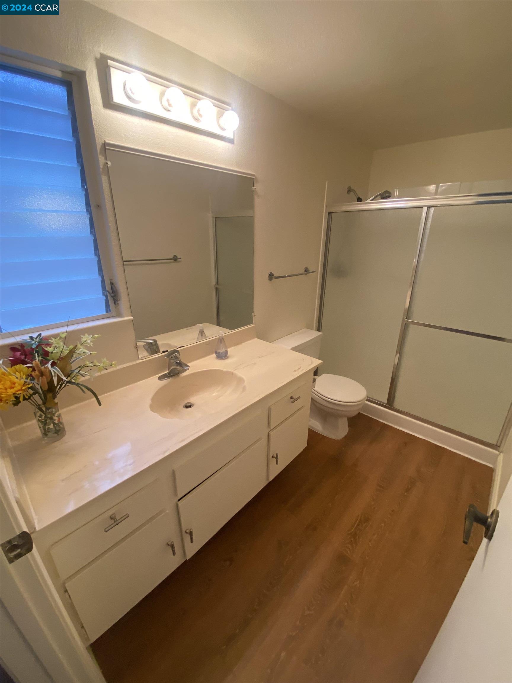 506 Tampico Walnut Creek, CA 94598 - Photo 27 of 32 a spacious bathroom with a double vanity sink and a mirror